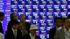 Asian Shares Boosted By Strong Dollar But Commodities Hit